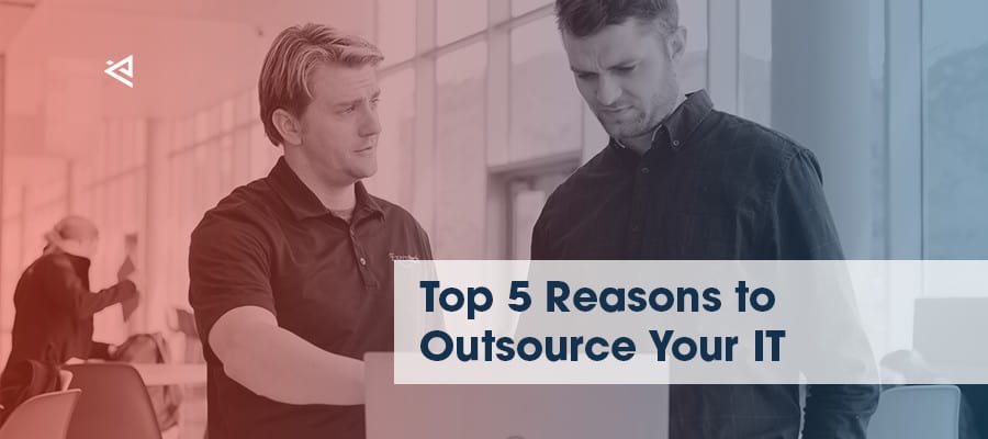 Outsourced IT technician helping employee with computer