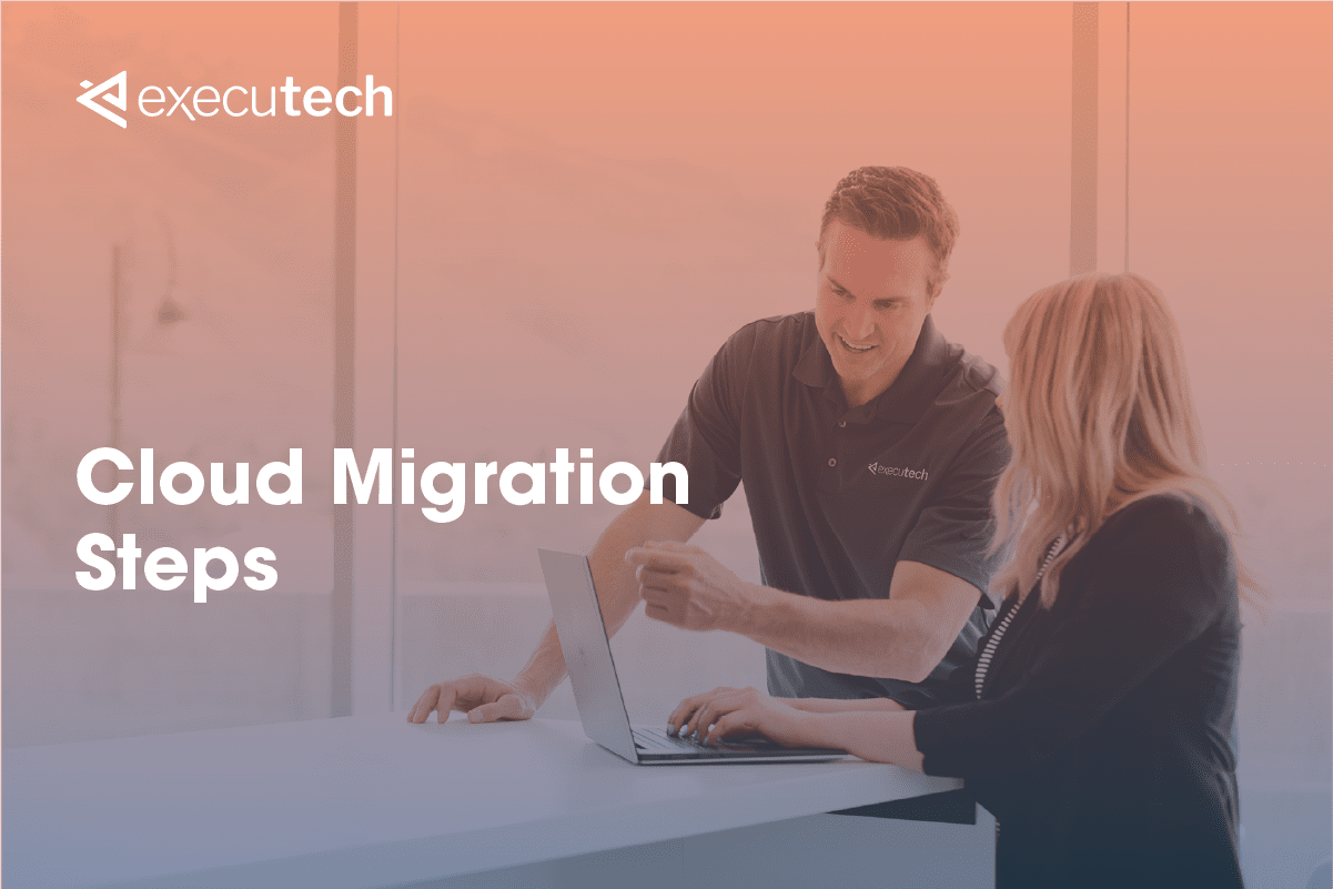 Male technician helping a woman with her computer in an office setting