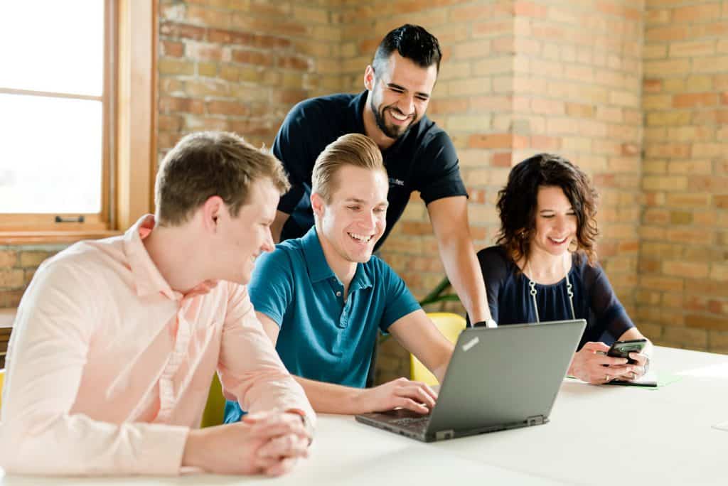 Executech employee assisting client