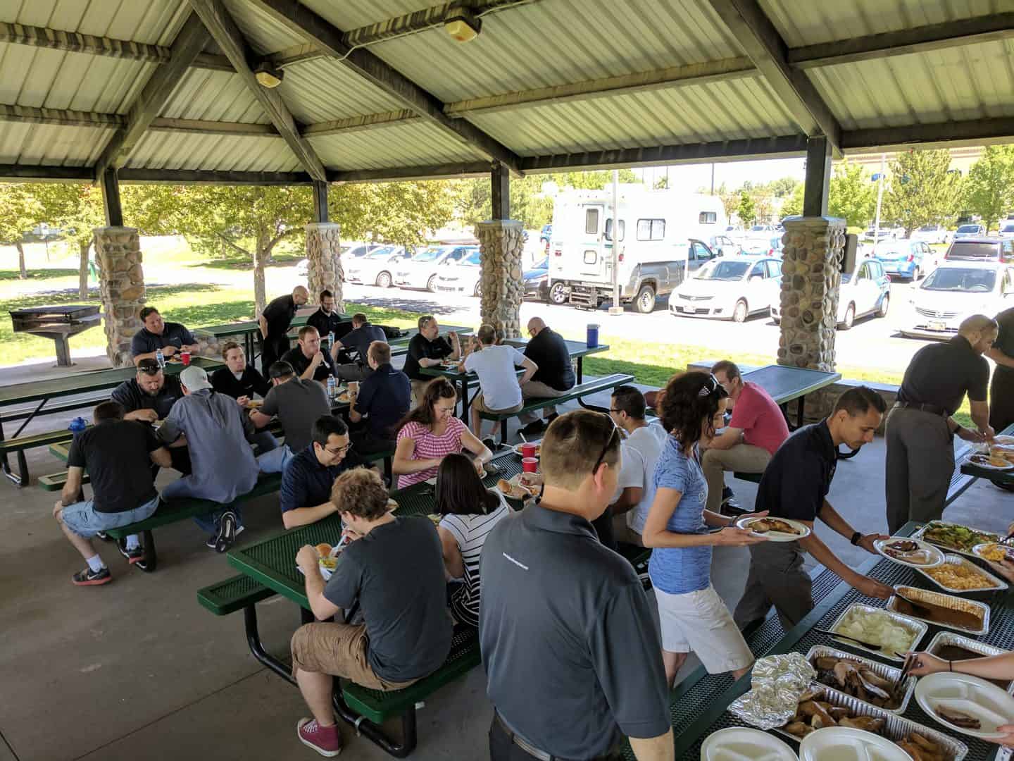 Executech employees enjoy spending time together at a company BBQs.